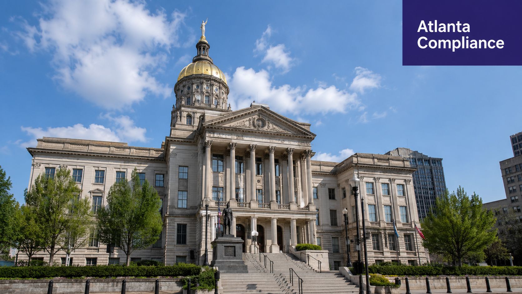 The Georgia State Capitol building in Atlanta under a blue sky with green trees.
